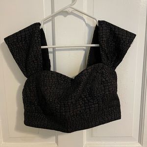 The perfect black going out top! Fits size medium never worn!